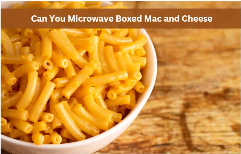 a bowl of microwaved boxed mac and cheese sitting on a wooden table